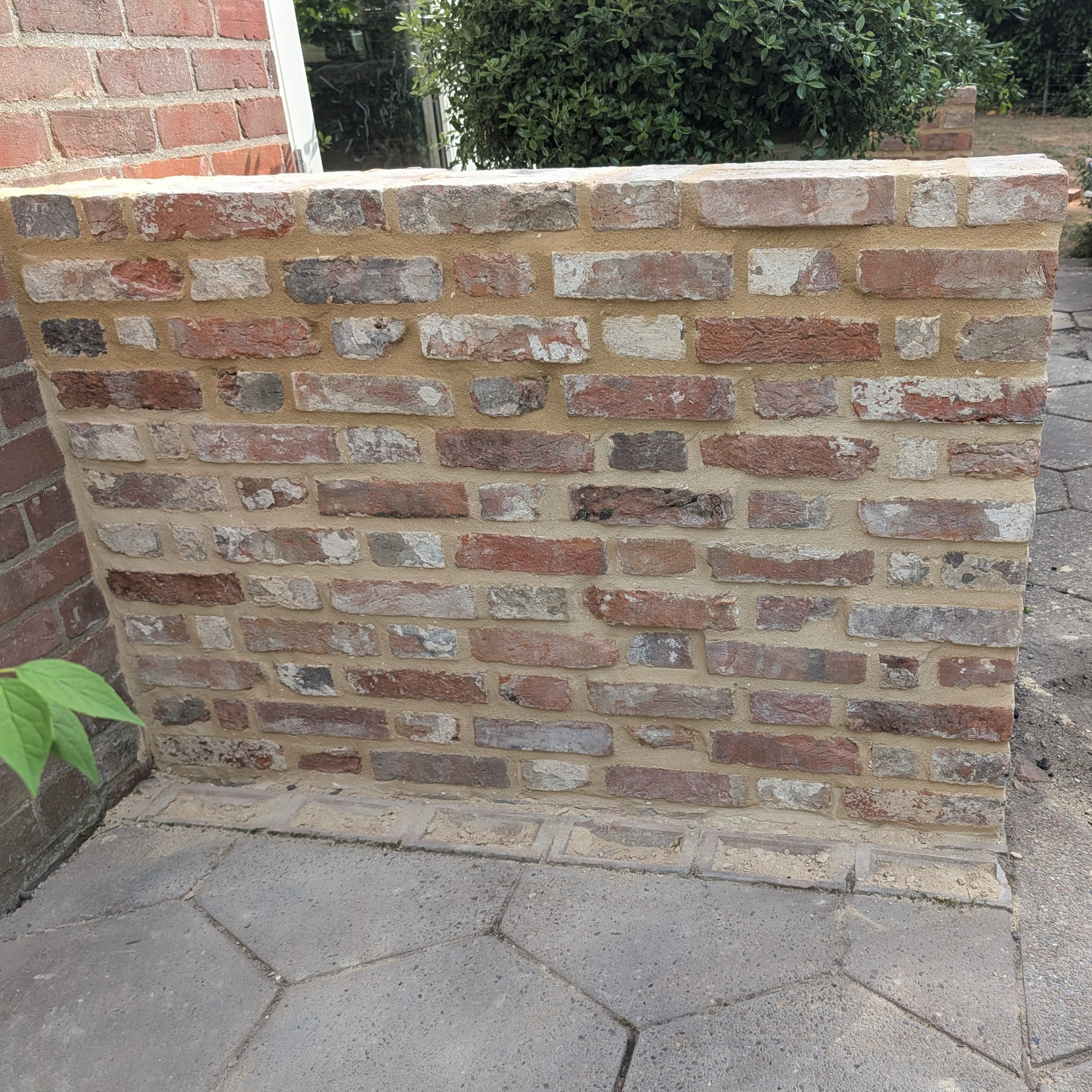 Reclaimed brick wall for porch