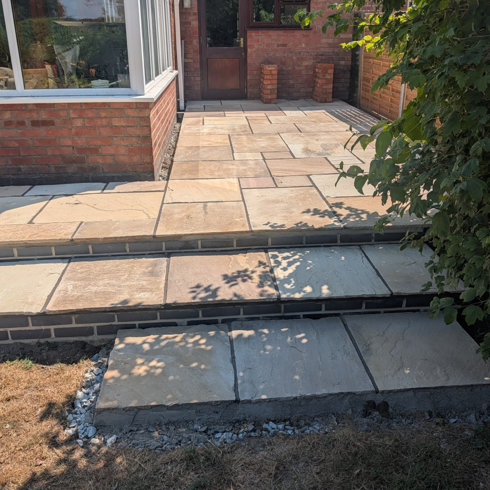 dark stone random modular patio